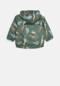 Grüne Kapuzenjacke mit Dinosaurier- und Blattmuster. Hergestellt aus leichtem Material, mit elastischen Bündchen und einer gerafften Kapuze.