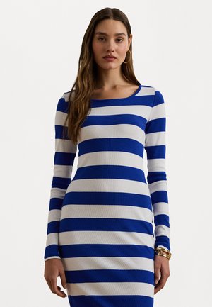 Long-sleeve dress featuring alternating blue and white horizontal stripes, a boat neck design, and ribbed texture. Accented with gold bracelets.