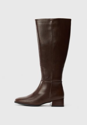 Tall dark brown leather boot with a low block heel and a smooth finish, shown from the side on a white background.