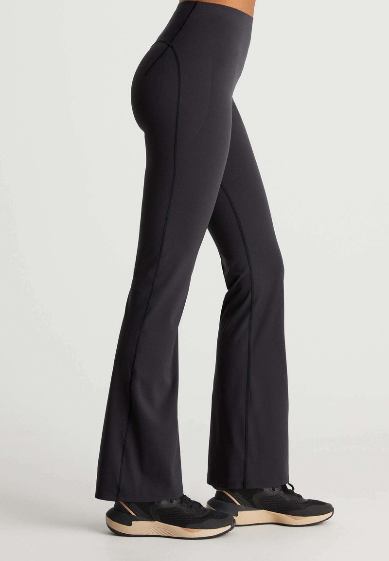 OYSHO RAISE UP COMPRESSIVE FLARE Trousers black Zalando.ie