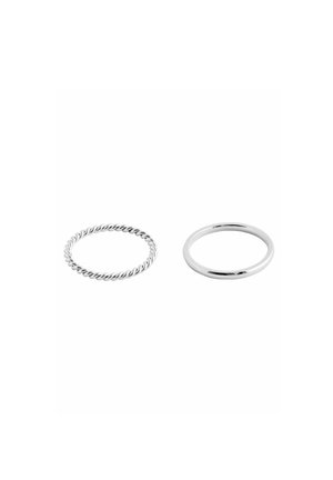 Set of two silver rings; one is twisted for texture, the other has a smooth, polished finish. Both rings are circular in shape.