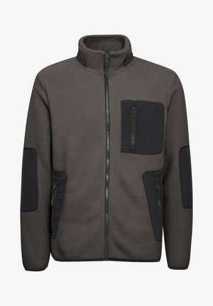 Tumehall fleece jakk, millel on tõmblukuga esiosa; mustad aktsendid taskutel ja varrukatel. Tekstureeritud kangas ja kõrge krae.