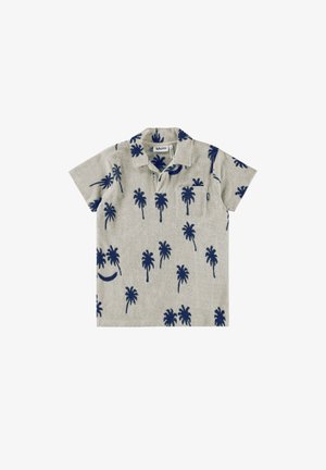 Textúrált anyagból készült polo póló, sötétkék pálmafával mintázva, világos bézs háttéren, rövid ujjakkal és elülső zsebre elhelyezve.