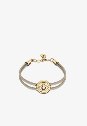 Bracelet en cuir avec deux bracelets gris, présentant un accent central doré avec un motif d'œil et une pierre transparente. Fermeture à pince homard.