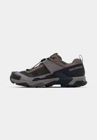 Outdoor shoe featuring a gray and dark blue design with textured fabric, sturdy sole, and adjustable lacing system for secure fit.