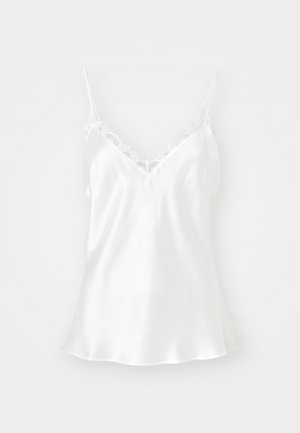 Witte satijnen camisole met kantafwerking langs de V-hals en verstelbare spaghettibandjes. Zachte textuur, uitlopende zoom.