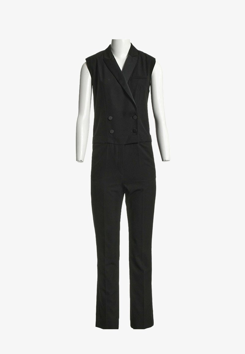 Combinaison blazer noire sans manches à double boutonnage avec col à revers et pantalon droit, présentée sur un mannequin blanc.