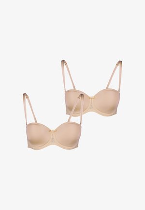 To beige bh'er med formede skåle, blondeoverflader og justerbare stropper. Hver har en central udsmykning og en glat tekstur.