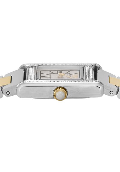 Rectangular silver watch with gold accents, Roman numeral dial, decorative side details, and a round crown with a white center.