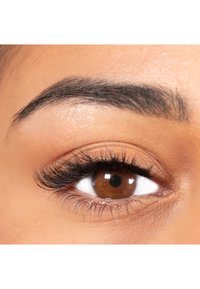 Close-up of a brown eye with defined eyelashes, a smooth eyelid, and well-groomed eyebrow, showcasing a natural skin tone and texture.