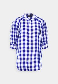 Chemise à manches longues à carreaux bleu et blanc avec col montant et poignets boutonnés, étiquetée Polo Ralph Lauren.