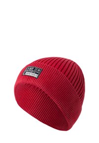 Red knitted beanie with ribbed texture. Features a black label with "CAMP DAVID" and "LIMITED TM NO. 01" stitched on the front.