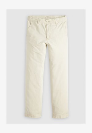 Pantalons loose-fit beige clair avec trois poches, passants de ceinture et une coupe droite. Fabriqués en un doux mélange de coton.