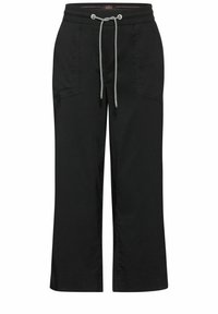 Schwarze, verkürzte Hose aus weichem Material, mit einem elastischen Taillenbund und Kordelzug, Seitentaschen und lockerer Passform.