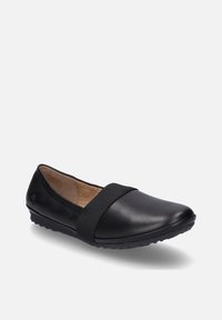 Chaussure plate en cuir noir avec un bout rond, dotée d'un bande élastique sur le dessus du pied et d'une semelle en caoutchouc texturé pour une meilleure adhérence.