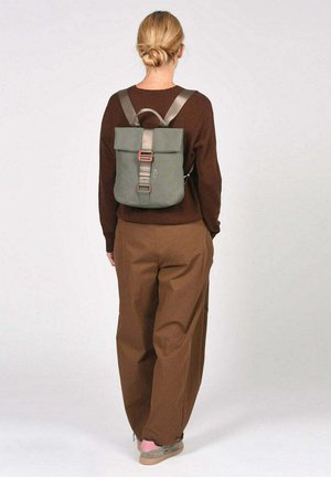 Green backpack with rolled top, gray straps, and metal buckles. Made of durable material. Rectangular shape with minimal design.