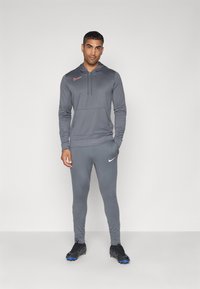 Nike Performance STRIKE PANT - Tréningruha alsók - iron grey/dragon red/white