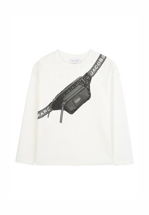 White long-sleeve shirt with a black graphic fanny pack design, zippered pocket, and branded black strap with "MARC JACOBS" text.