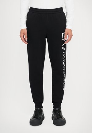 TRAIN LOGO SERIES PANTS - Tracksuit bottoms - black/white