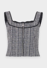 Top court en tweed bleu marine et blanc avec un encolure carrée, sans manches et une fermeture éclair à l'avant avec un tirette de marque.