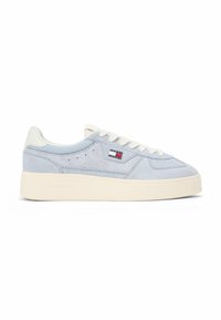 Light blue suede low-top sneaker with white laces, cream sole, and a small Tommy Jeans logo on the side panel.