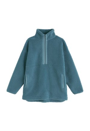 Maglione in pile color teal con collo con mezza cerniera, grande tasca frontale e superficie strutturata. Morbido al tatto e vestibilità comoda e rilassata.