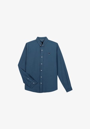 Chemise boutonnée à manches longues en coton bleu sarcelle profond, arborant un discret motif brodé et un col classique avec des poignets boutonnés.