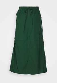 Grön, lättviktig, midilång kjol med elastisk midja och dragsko. Har en lagerdesign och sidostripes.