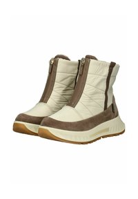 Beige en bruine enkelboots met een bovenkant van quilted stof, zijritsen en zwarte rubberen zolen met een driehoekig patroon.
