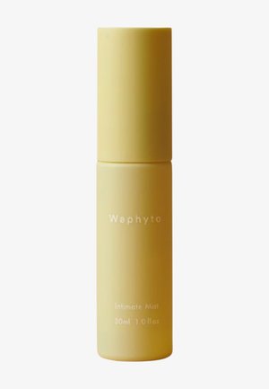 Żółta cylindryczna butelka oznaczona Waphyto Intimate Mist, 30 ml, z dopasowaną zakrętką na białym tle.