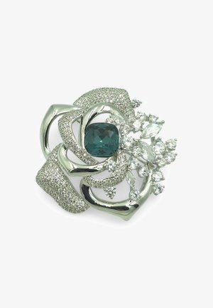 Silberfarbener Blumenanstecker mit einem zentralen türkisfarbenen Stein, umgeben von klaren Strasssteinen und strukturierten metallischen Spiralen.