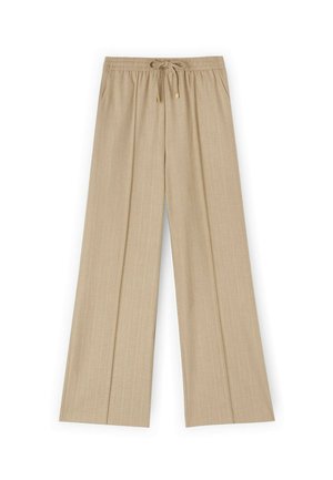 Pantalones de pierna ancha beige con una tela texturizada, que presentan una cintura elástica y un cierre de cordón con herrajes dorados.