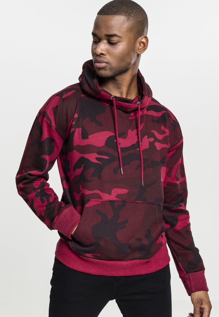 Felpa con cappuccio a maniche lunghe in camouflage rosso e nero, con cappuccio regolabile, tasca frontale e polsini a costine. Realizzata in un morbido tessuto misto cotone.