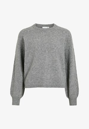 Pilkas tekstūruotas megztinis su apvaliu iškirpimu, nusileidusiomis pečių siūlėmis ir gumuotomis rankogaliais bei apačia. Pagamintas iš mezginio audinio su subtiliu raštu.