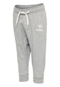 Grå träningsoverallsbyxor med elastisk midja och dragsko. Funkar med ribbade muddarna och liten vit logotypdetalj. Mjukt tyg med en slät textur.