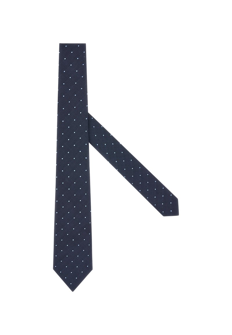 Námořnická modrá kravata s bílými puntíky, vyrobená z texturované látky. Má štíhlý design s špičatou špičkou a dlouhou částí visící vzadu.