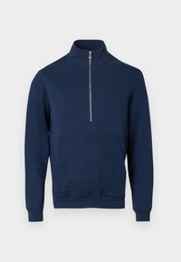 Φούτερ σε ναυτικό μπλε με ψηλό γιακά και φερμουάρ τετάρτου μήκους. Διαθέτει υφασμάτινη επιφάνεια με υφή στο μπροστινό μέρος και ελαστικές μανσέτες και στρίφωμα.