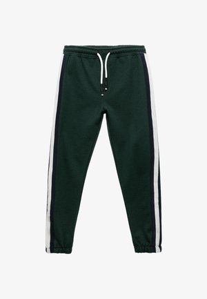 Grüne Baumwoll-Sweatpants mit elastischem Bund, weißem Kordelzug und vertikalen weißen und dunkelblauen Seitenstreifen. Mit geripptem Knöchelabschluss.