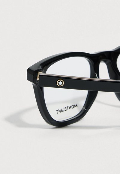 Černé acetátové brýle s odvážným obdélníkovým tvarem, průhlednými čočkami a zlatým zdobením na pantů. Logo "Montblanc" na vnitřn�í straně.