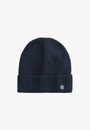 Berretto lavorato a maglia blu navy con una texture a coste, dotato di risvolto e di una piccola etichetta con logo sul lato.