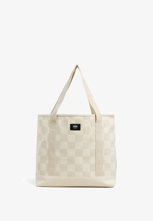 Beżowa torba w kratkę wykonana z trwałego płótna, z mocnymi paskami z materiału i czarną naszywką z logo z przodu.