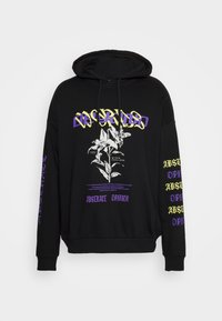 Black hooded sweatshirt featuring floral graphic and text in purple and yellow. Long sleeves with more text in purple along the right arm.