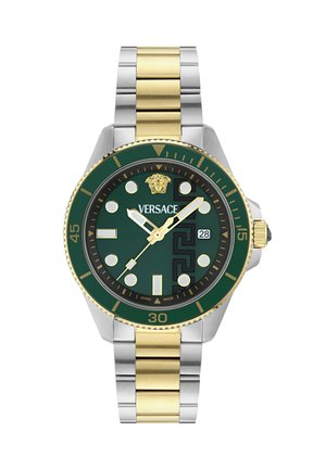 Rohelise sihverplaadiga Versace käekell kuldse ja hõbedase metallrihmaga, Medusa logo kell 12 asendis, kuupäeva näidik ning kuldsete detailidega osutid ja märgid.
