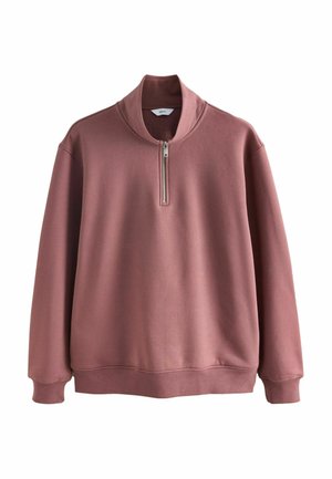 Różowy sweter z wysokim kołnierzem i krótkim zapięciem na zamek. Wykonany z miękkiego materiału, z prążkowanymi mankietami i dołem, zapewniającymi dopasowane wykończenie.