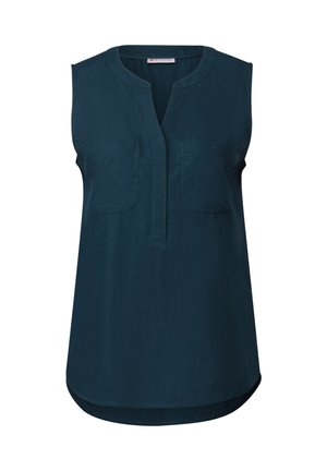 Blouse sans manches de couleur bleu sarcelle foncé avec un col en V, deux poches avant et un ourlet incurvé. Tissu lisse avec un léger éclat.