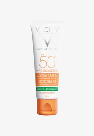 Vichy Capital Soleil SPF 50+ tube, white and orange with silver accents; 50 ml, features text detailing its sun protection and mattifying properties.