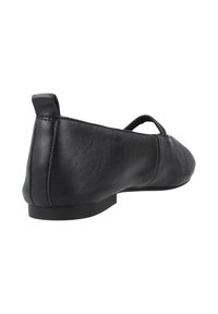 Bailarina de cuero negro con punta redondeada, diseño minimalista, lengüeta en el talón trasero, suela de perfil bajo y textura suave.