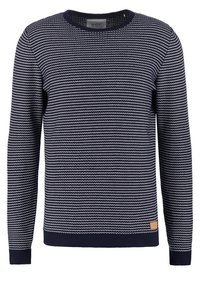 Tummansininen neulepaita, jossa on teksturoitu siksak-kuvio, pyöreä pääntie, resorit hihansuissa ja helmassa sekä pieni vaalea logoplässi alalaidassa.