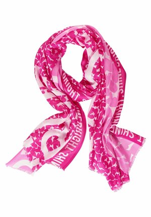 Écharpe rose et blanche à motifs avec formes abstraites et texte blanc partiel sur une bordure rose vif, pliée lâchement sur un fond blanc.