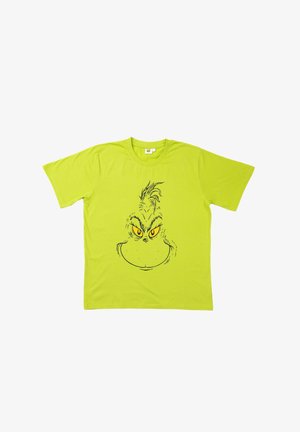 T-shirt in cotone verde lime con una linea nera che disegna il volto di un personaggio scontroso, con grandi occhi gialli e capelli appuntiti.